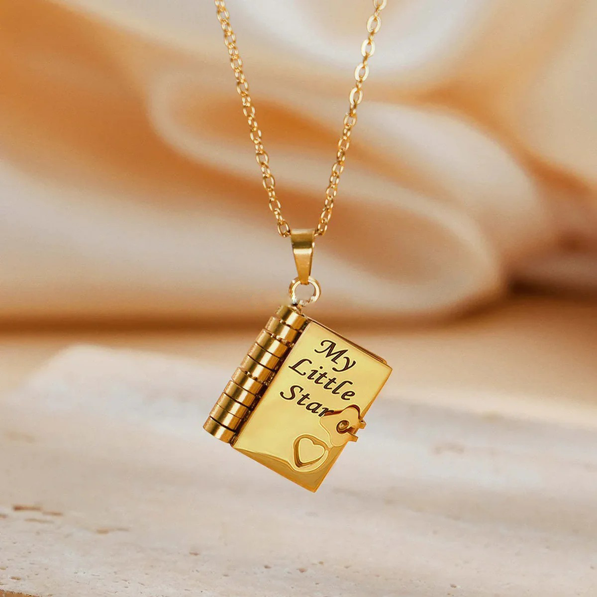 Flip-top engraved book necklace