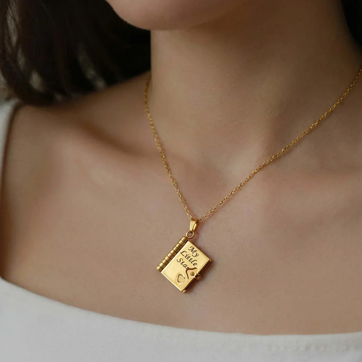 Flip-top engraved book necklace